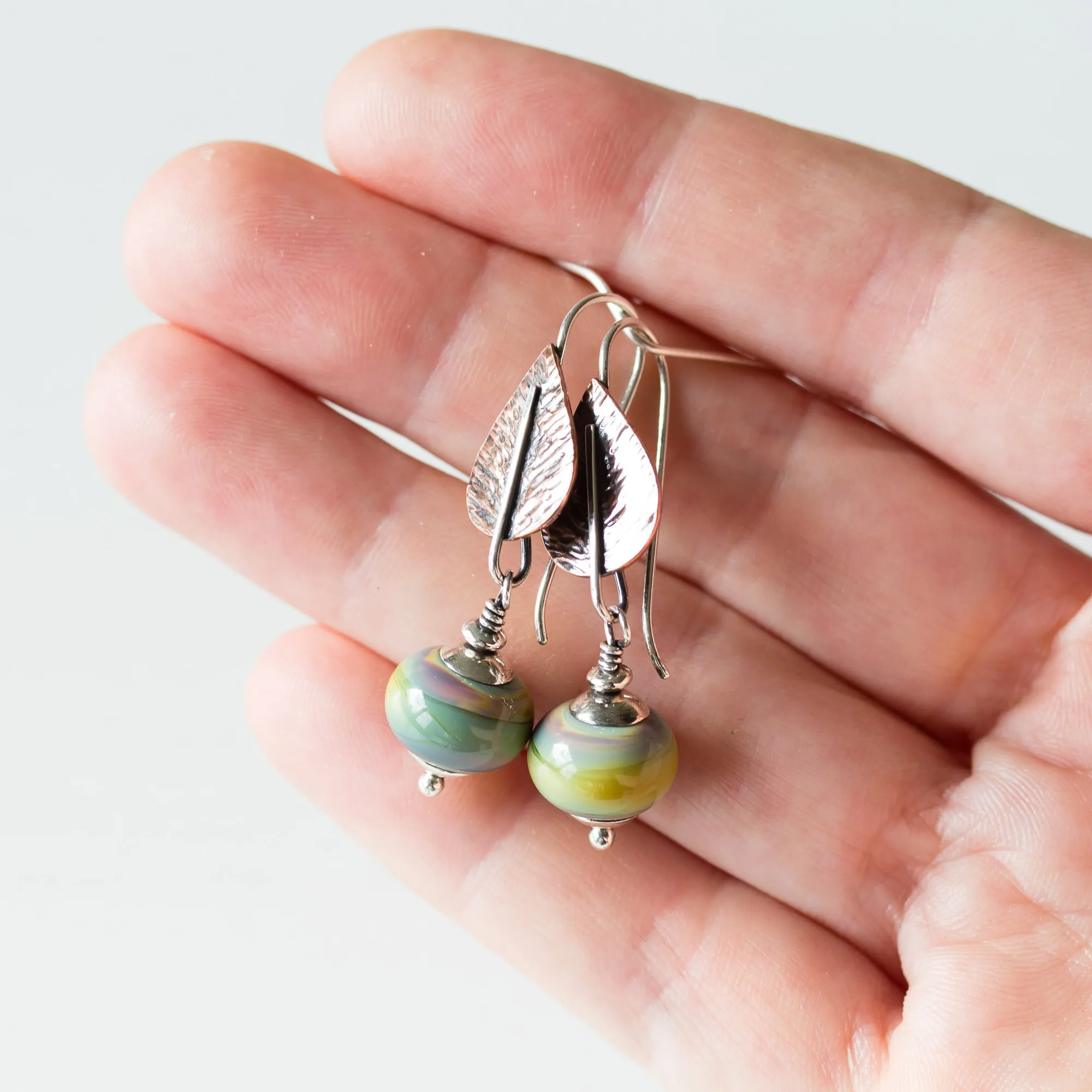 Pastel Green Earrings, hammered copper leaf with lampwork beads