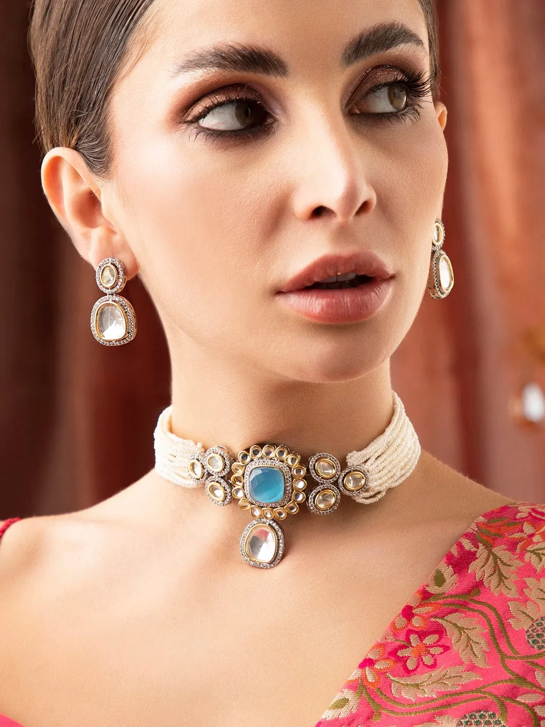 Rubans Gold Plated Kundan Choker Set With White Beads And Blue Stones